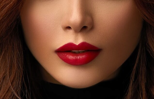 woman with red hair and black lipstick
