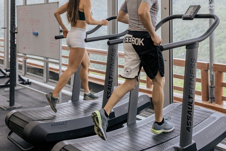 man and woman on a treadmill